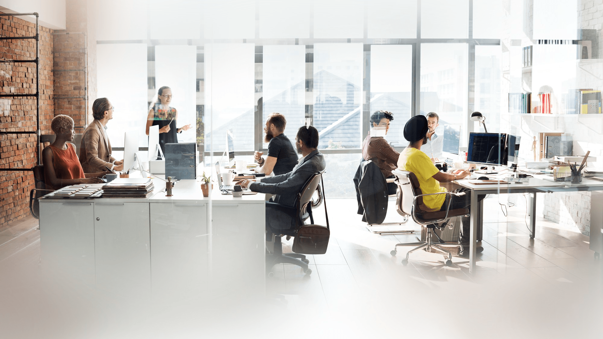 A modern agency team collaborating in a bright workspace